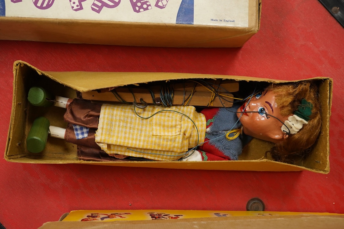 Five boxed Pelham Puppets including; a Type SL Hansel, Gretel, Bembo the Clown, the Policeman with moving mouth, Mr. Turnip